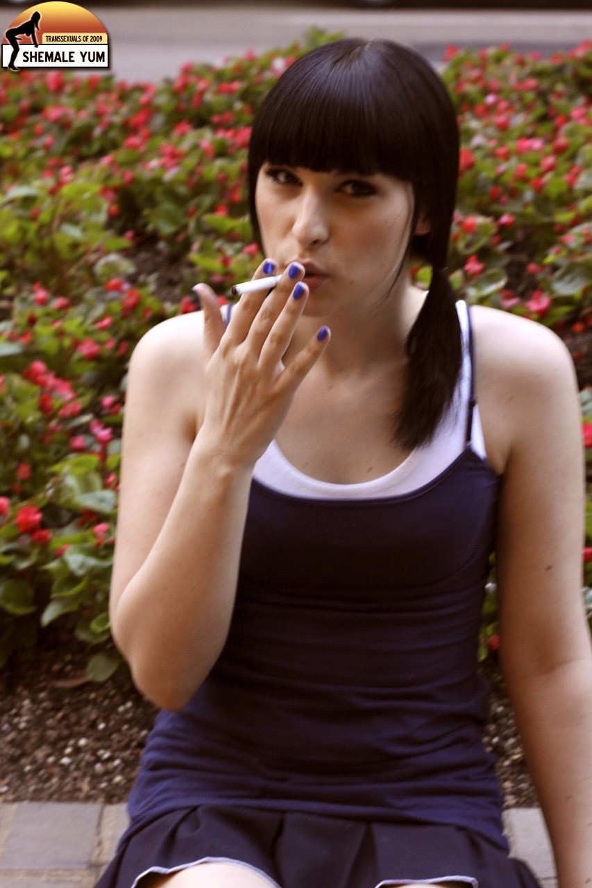 bailey_jay black_hair breasts cigarette clothed long_hair looking_at_viewer nail_polish non-nude outside porn_star shemale shemaleyum sitting smoking solo transgender watermark white