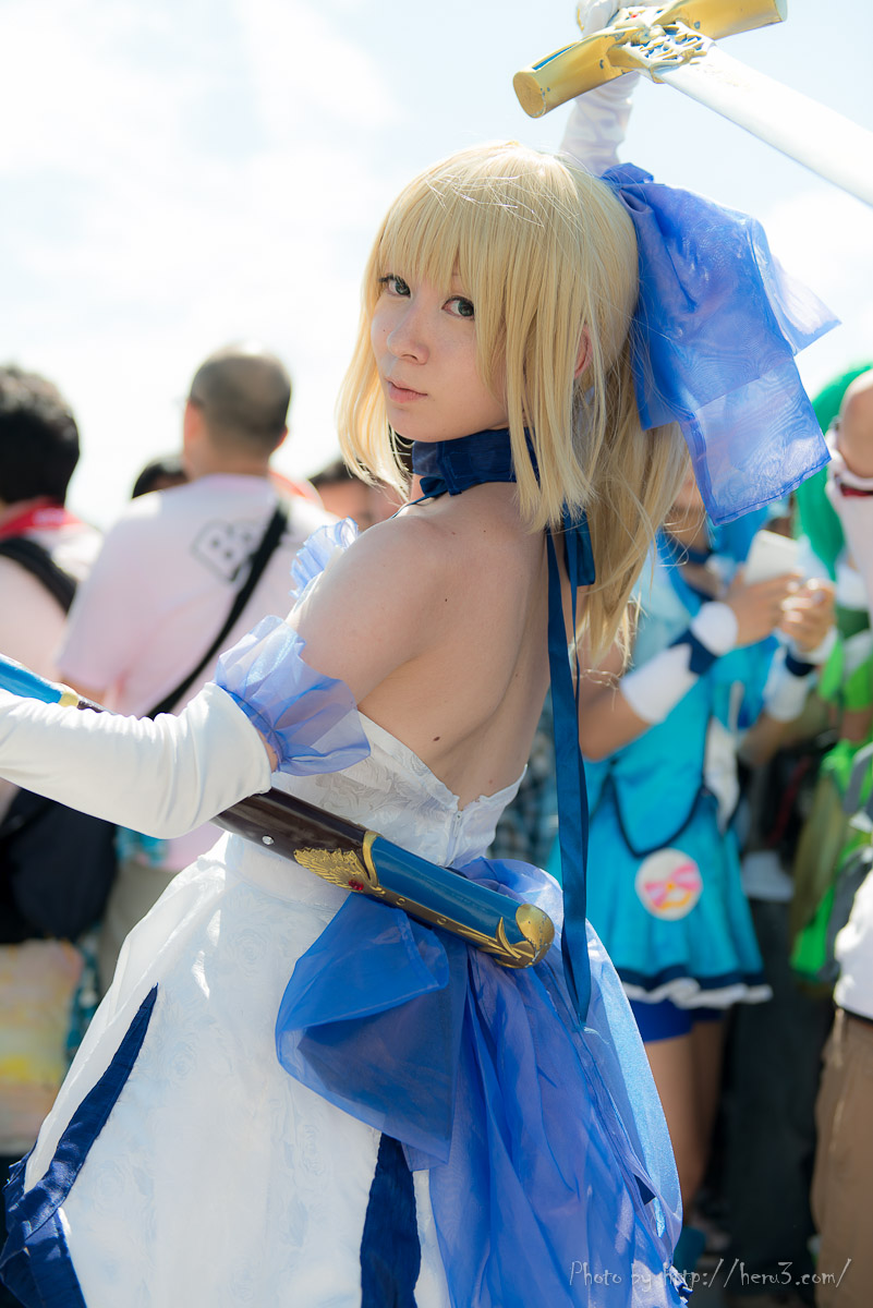 1girl asian blonde_hair breasts cosplay dress fate_(series) long_hair outside saber sword
