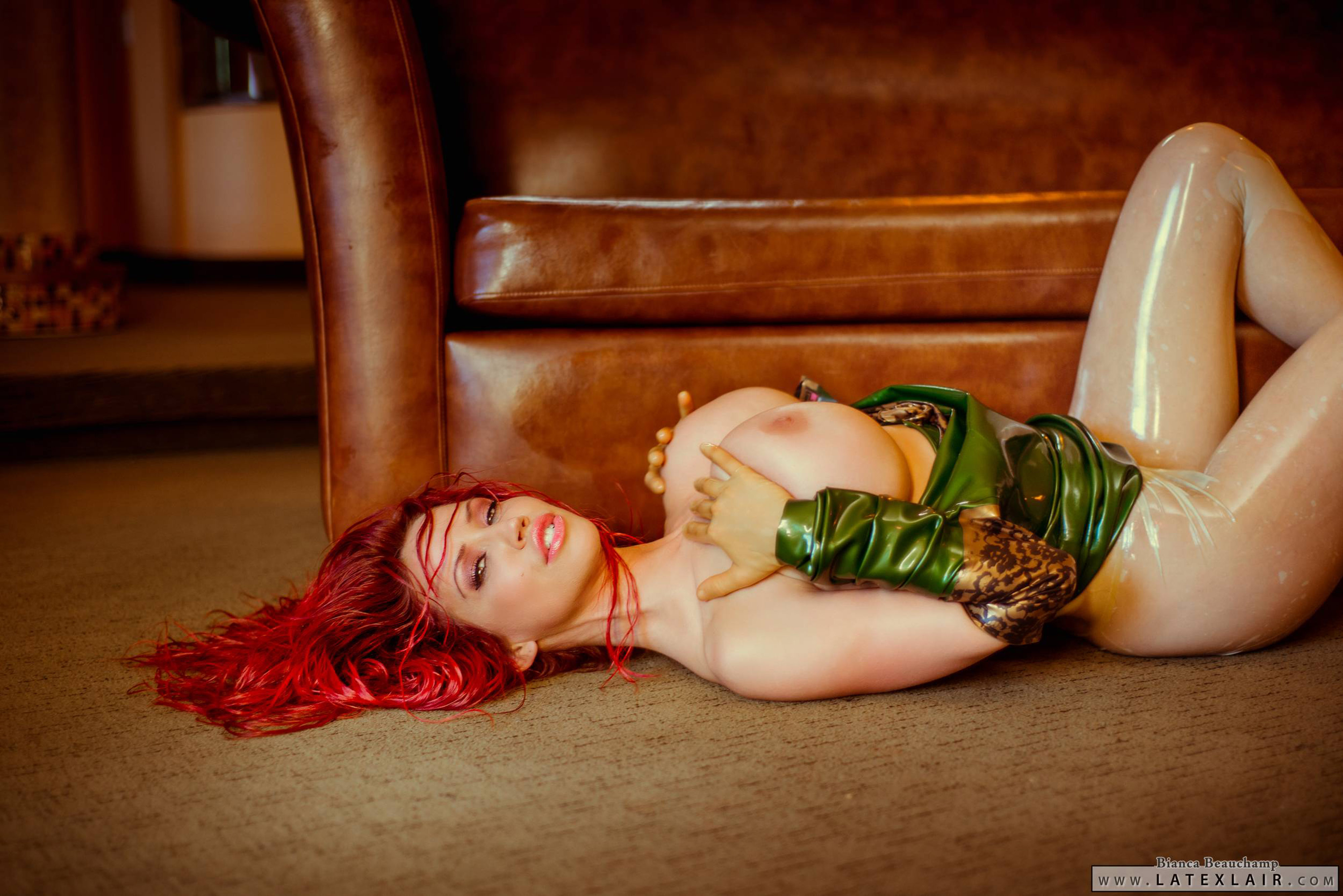 bianca_beauchamp breasts dress female high_heels large_breasts latex long_hair red_hair shoes sofa solo watermark