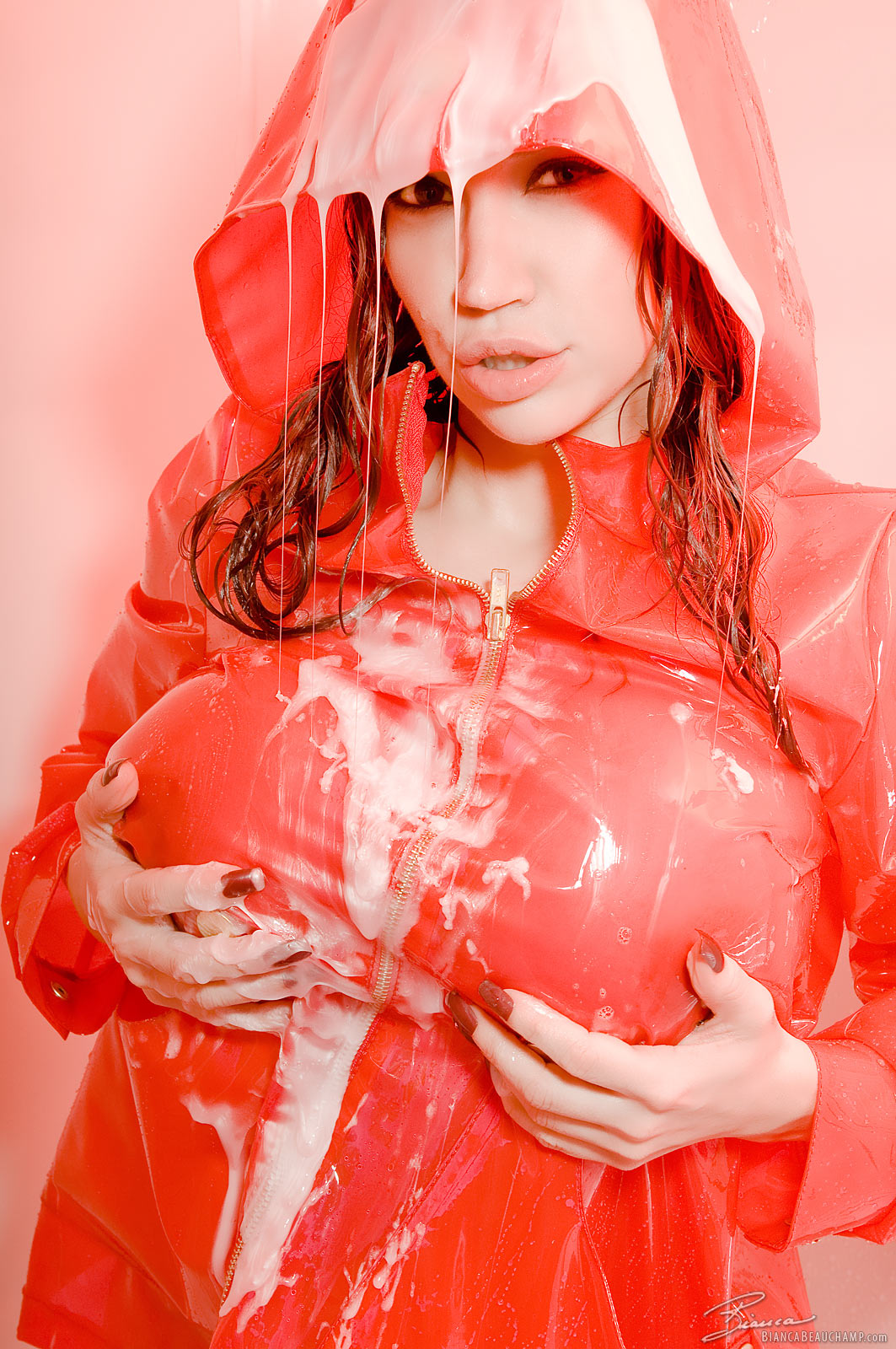 bianca_beauchamp breasts female large_breasts latex long_hair lotion nail_polish raincoat red_hair shower solo watermark wet