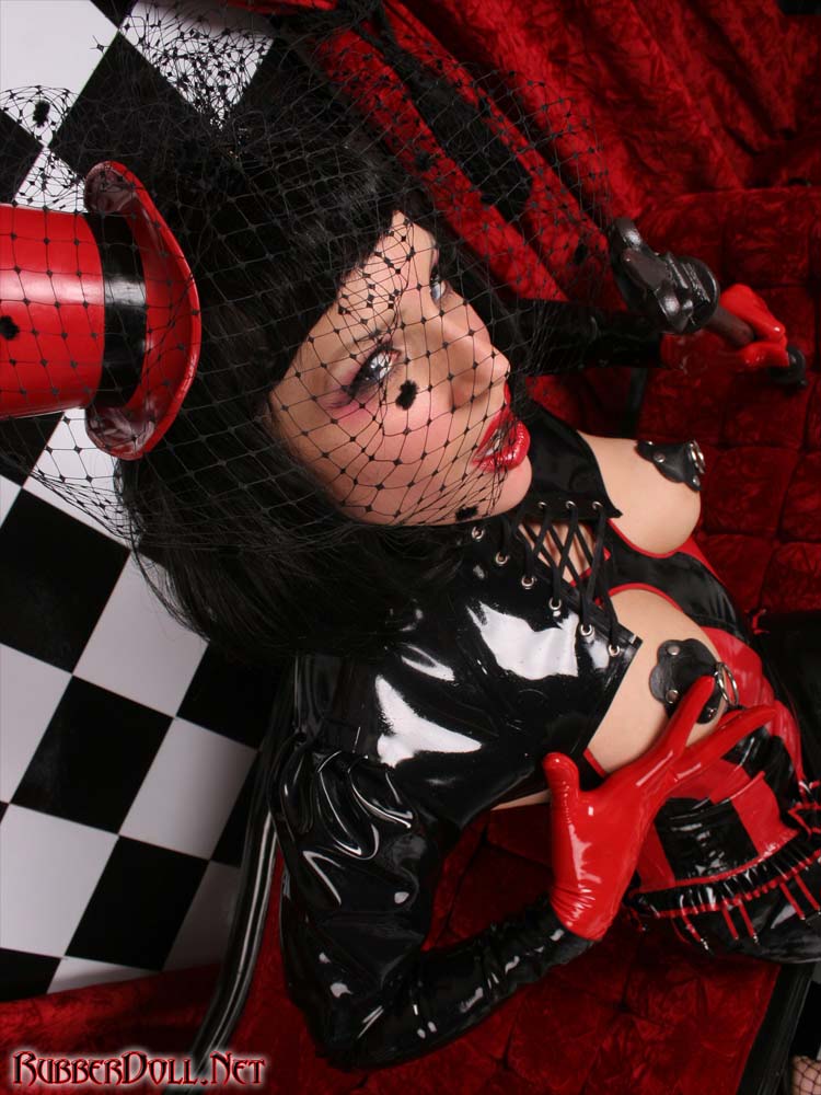 black_hair breasts cane female fishnets hat high_heels large_breasts latex lipstick long_hair pasties rubberdoll shoes skirt solo