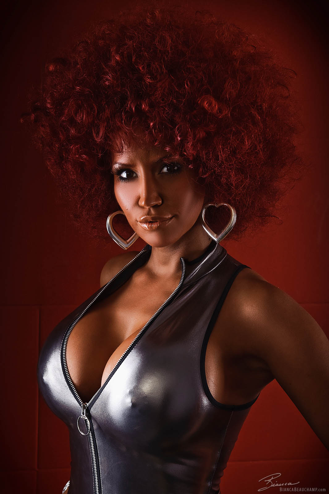 afro bianca_beauchamp breasts cleavage earrings female large_breasts long_hair red_hair simple_background solo watermark