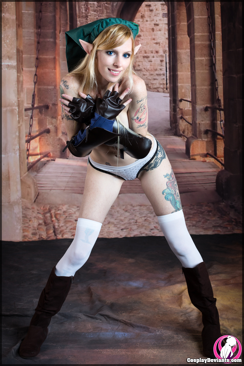 blonde_hair boots breasts cosplay female hat kneehighs lolita_zombie long_hair solo tattoo watermark