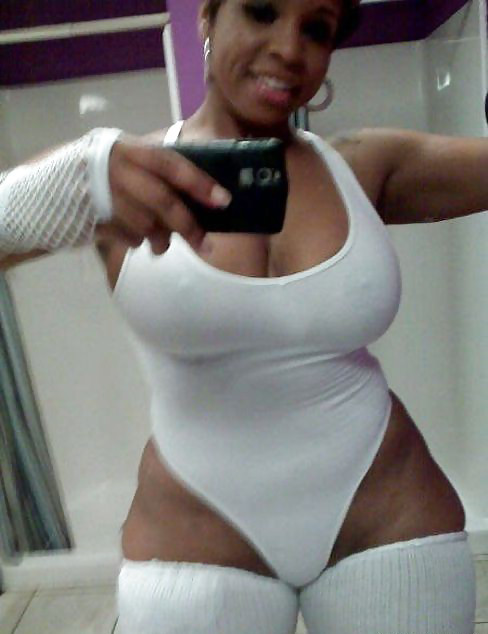 bathroom big_ass big_breasts breasts cellphone dark_skin gloves leg_warmer leotard mirror nipples photo see-through selfpic