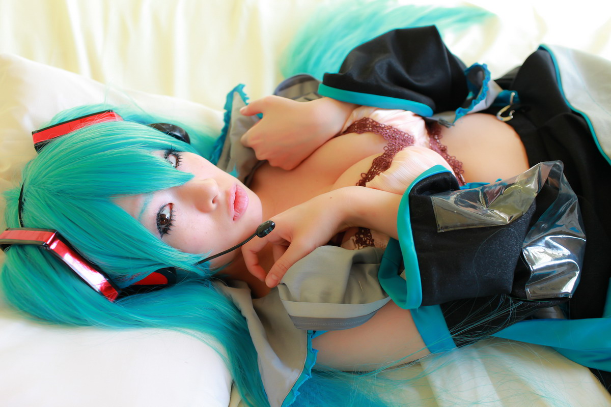 aqua_hair arai_yomi bed blouse bra cleavage cosplay detached_sleeves headset miku_hatsune open_clothes photo pleated_skirt real real_person skirt tie twin_tails vocaloid