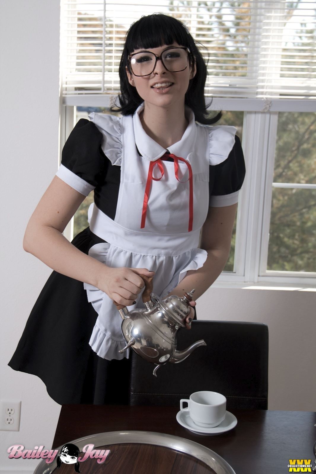 bailey_jay biting_tongue black_hair clothed cute glasses long_hair looking_at_viewer maid non-nude parted_lips ponytail shemale shemale_only solo watermark white