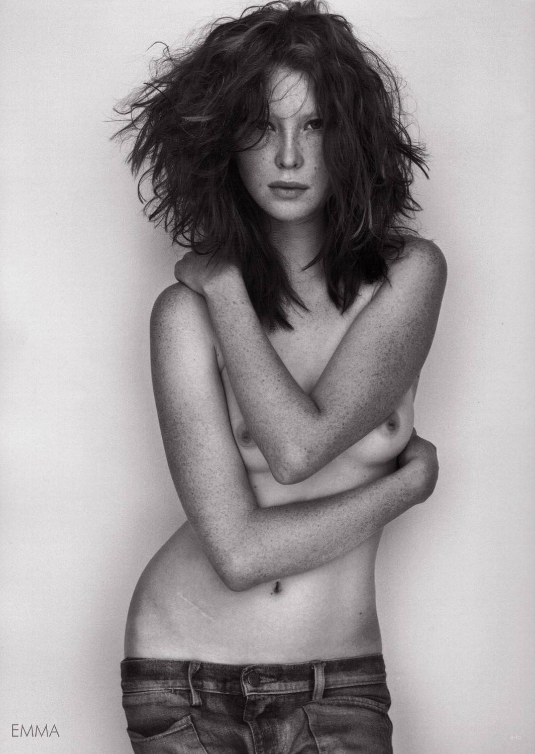 arm_across_chest arm_across_middle freckles jeans low_rise monochrome slender topless wavy_hair