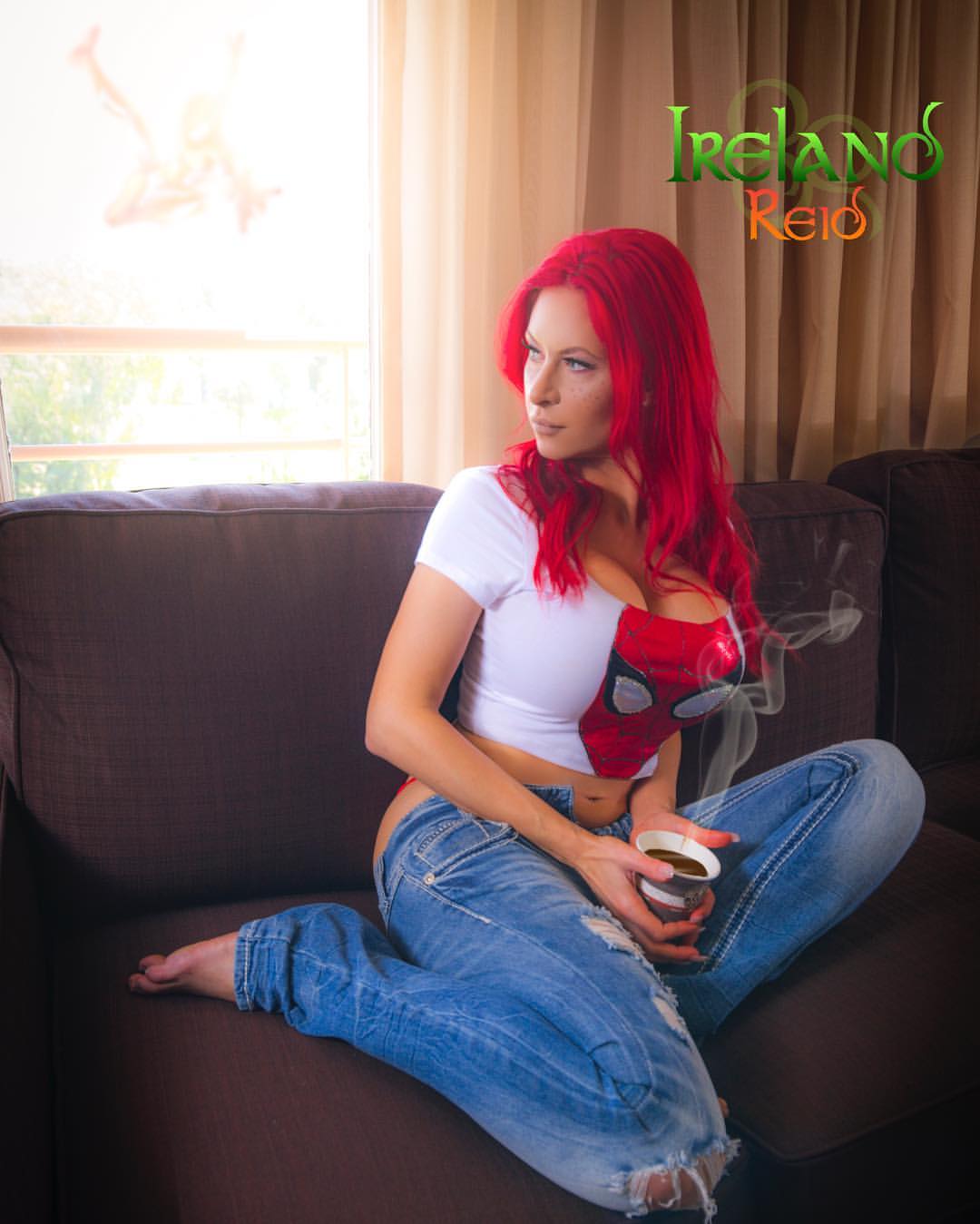 breasts cleavage clothes couch female ireland_reid living_room mug red_hair redhead solo spider-man spider-man_(series)