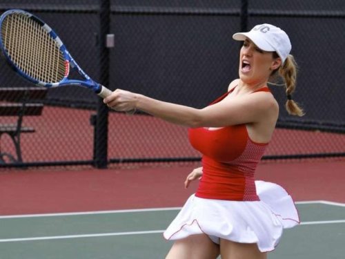 blonde_hair breasts brown_eyes cleavage female hat jordan_carver large_breasts playing_tennis skirt solo tennis