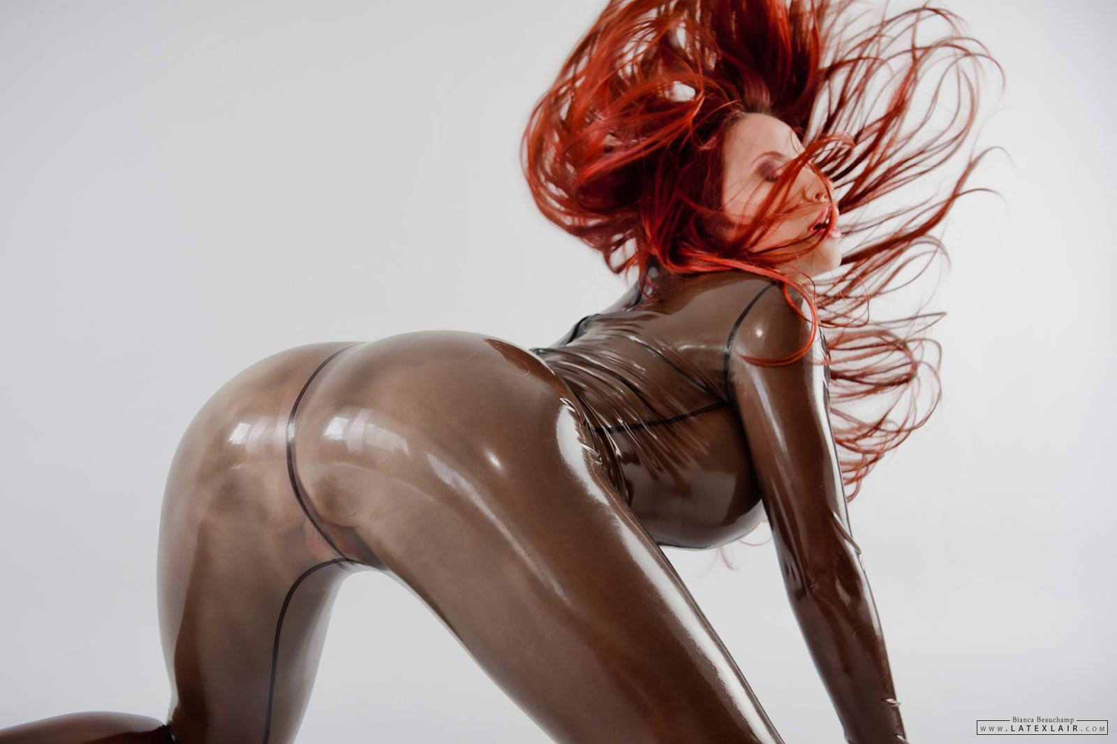 ass bianca_beauchamp breasts female large_breasts long_hair looking_back red_hair solo watermark