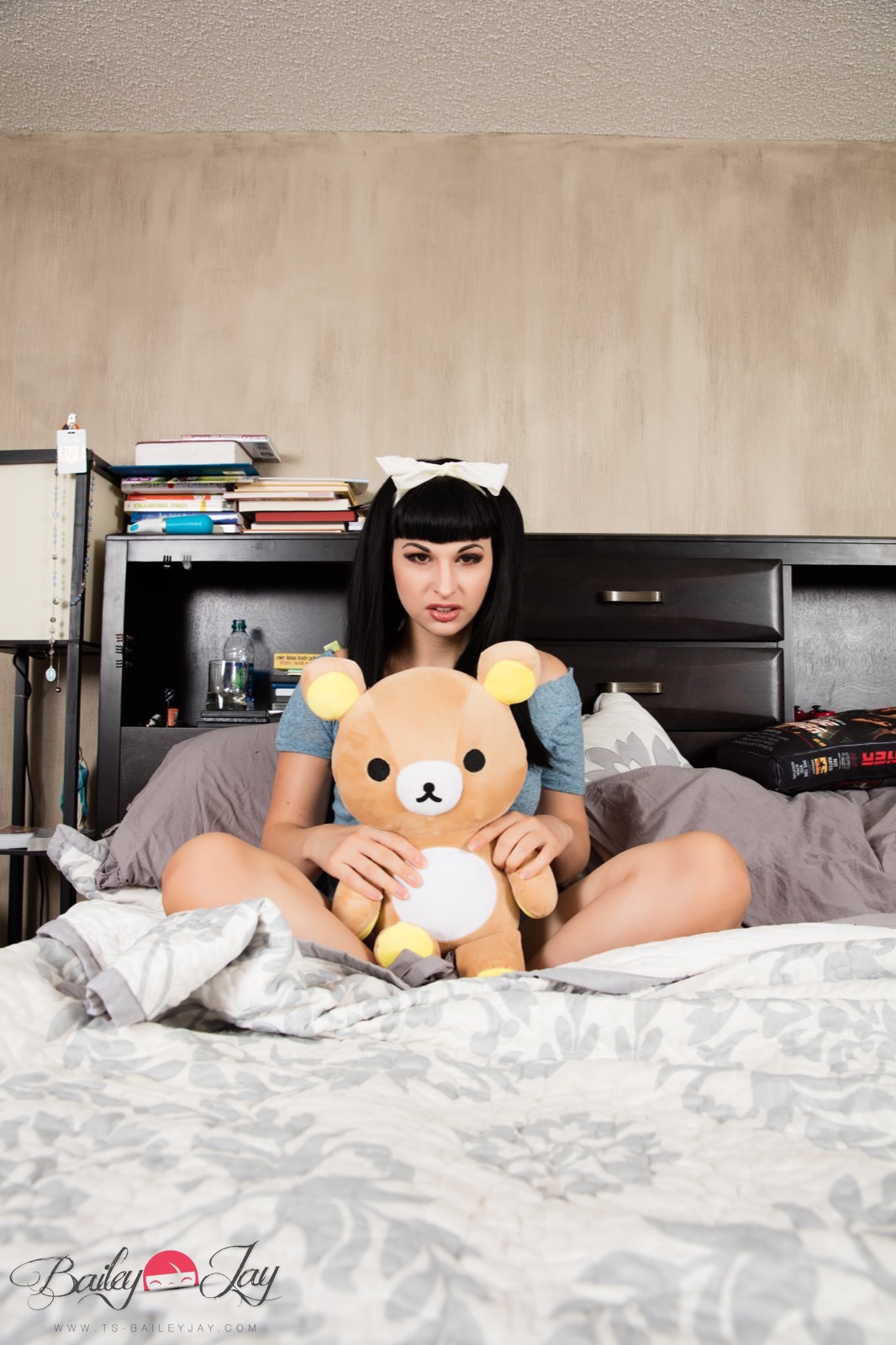 bailey_jay bed black_hair bow breasts long_hair shemale solo watermark