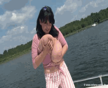 animated black_hair evil_smile gif gigantic_breasts looking_at_viewer milena_velba natural_breasts pov smile water