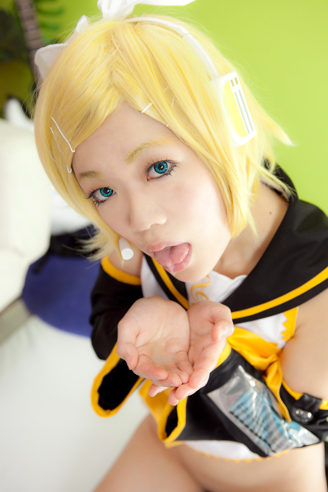 asian blonde_hair breasts female headphones long_hair open_mouth shoes sofa solo