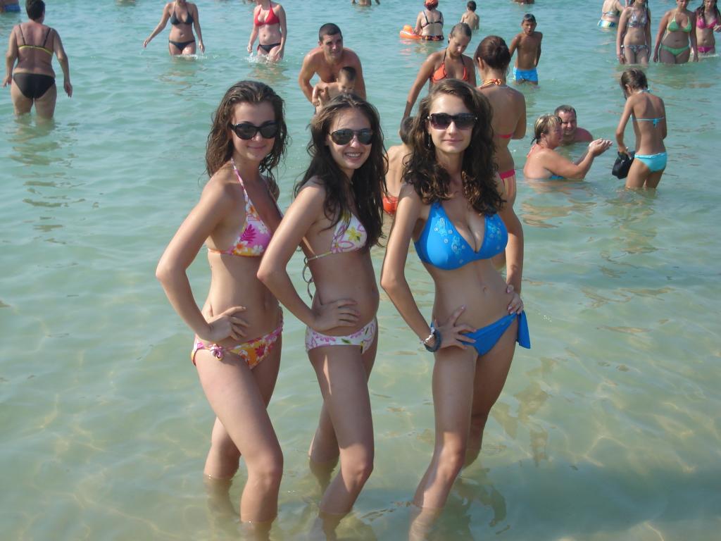 beach bra breasts brown_hair cleavage female glasses long_hair panties pose water wet