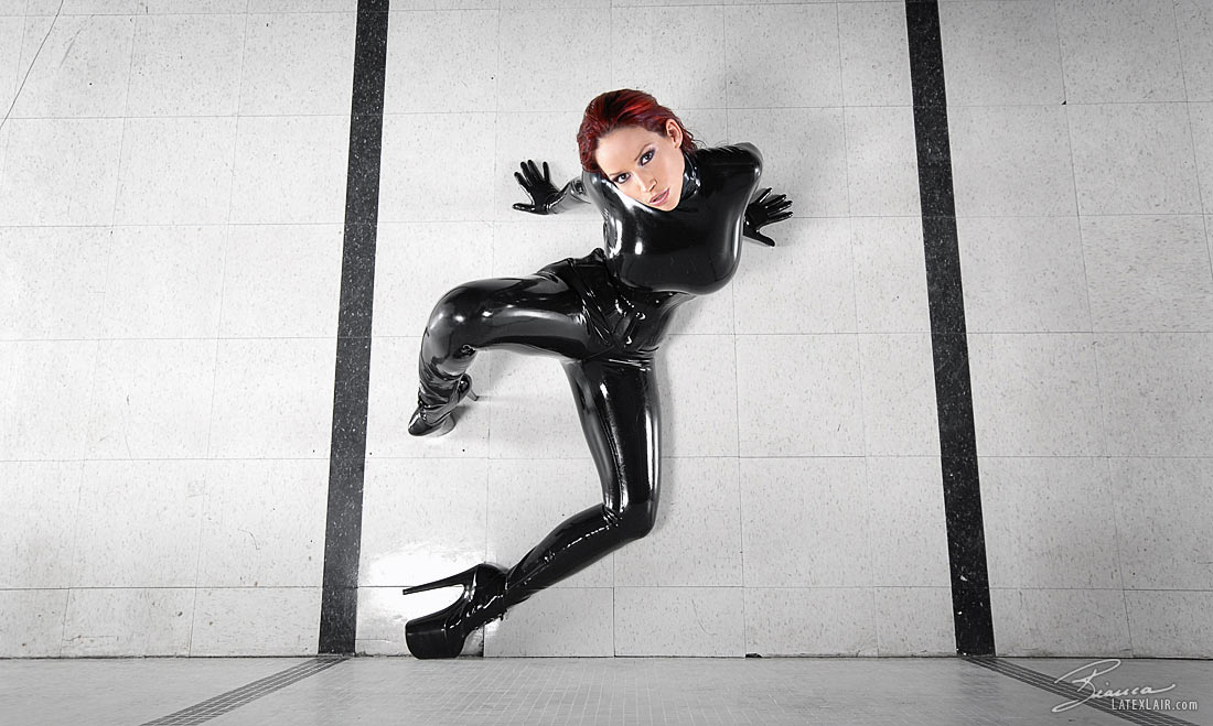 bianca_beauchamp breasts catsuit female gloves high_heels large_breasts latex long_hair red_hair shoes solo watermark