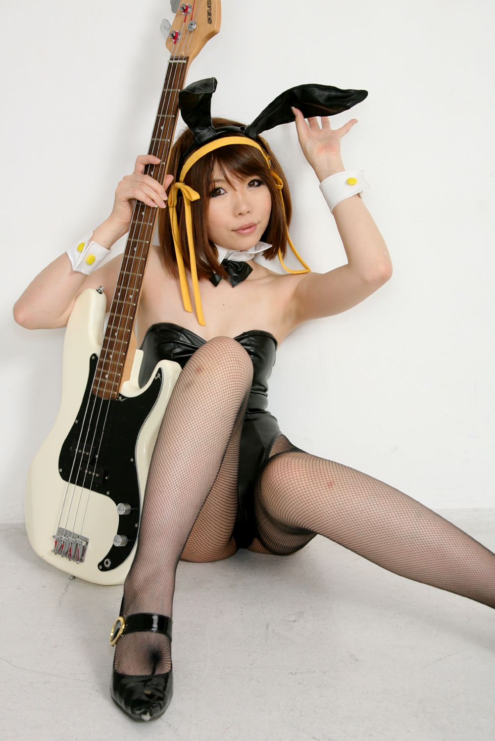 animal_ears asian bare_shoulders breasts brown_hair cosplay female guitar hairband high_heels leotard pantyhose shoes short_hair simple_background solo