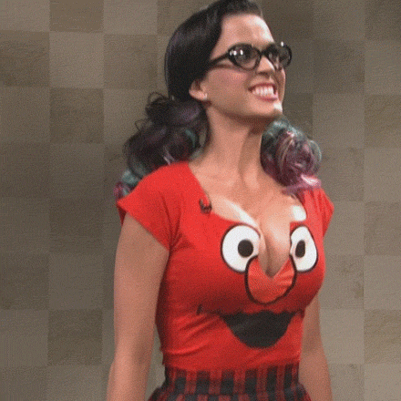 1girl animated black_hair bouncing_breasts breasts celebrity cleavage clothed dancing female female_only gif katy_perry long_hair non-nude open_mouth solo