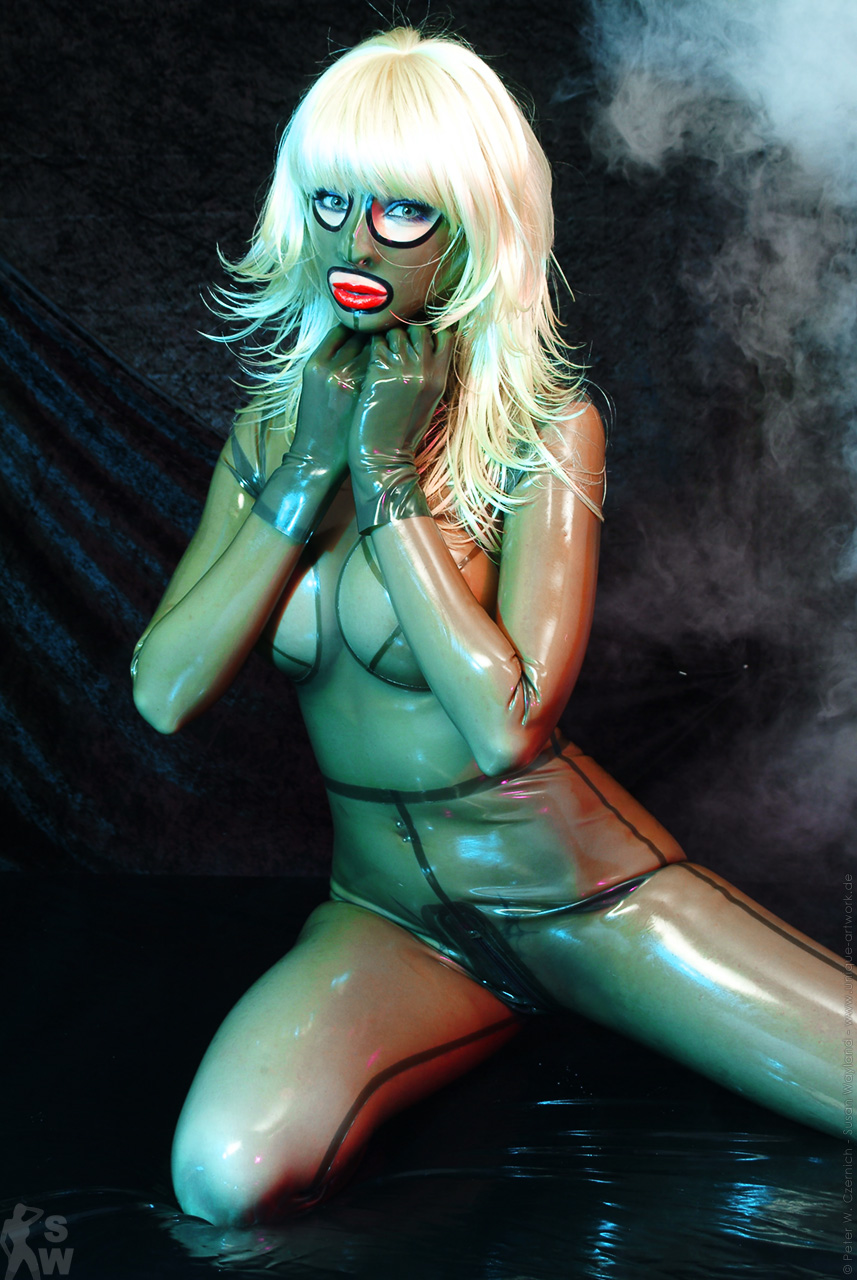 blonde_hair breasts catsuit female high_heels large_breasts latex long_hair mask shoes solo susan_wayland watermark