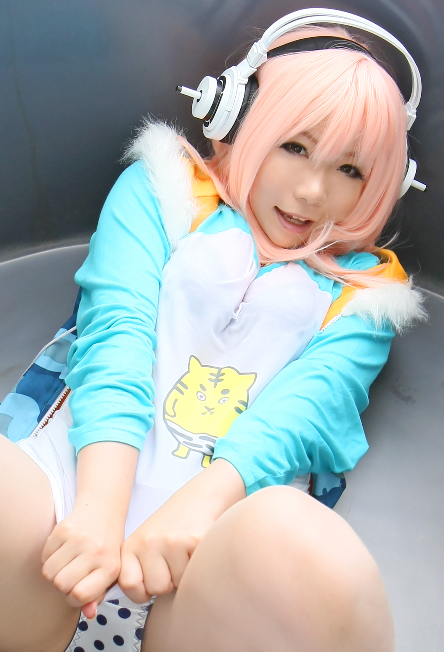 asian breasts cosplay female headphones large_breasts long_hair pink_hair solo