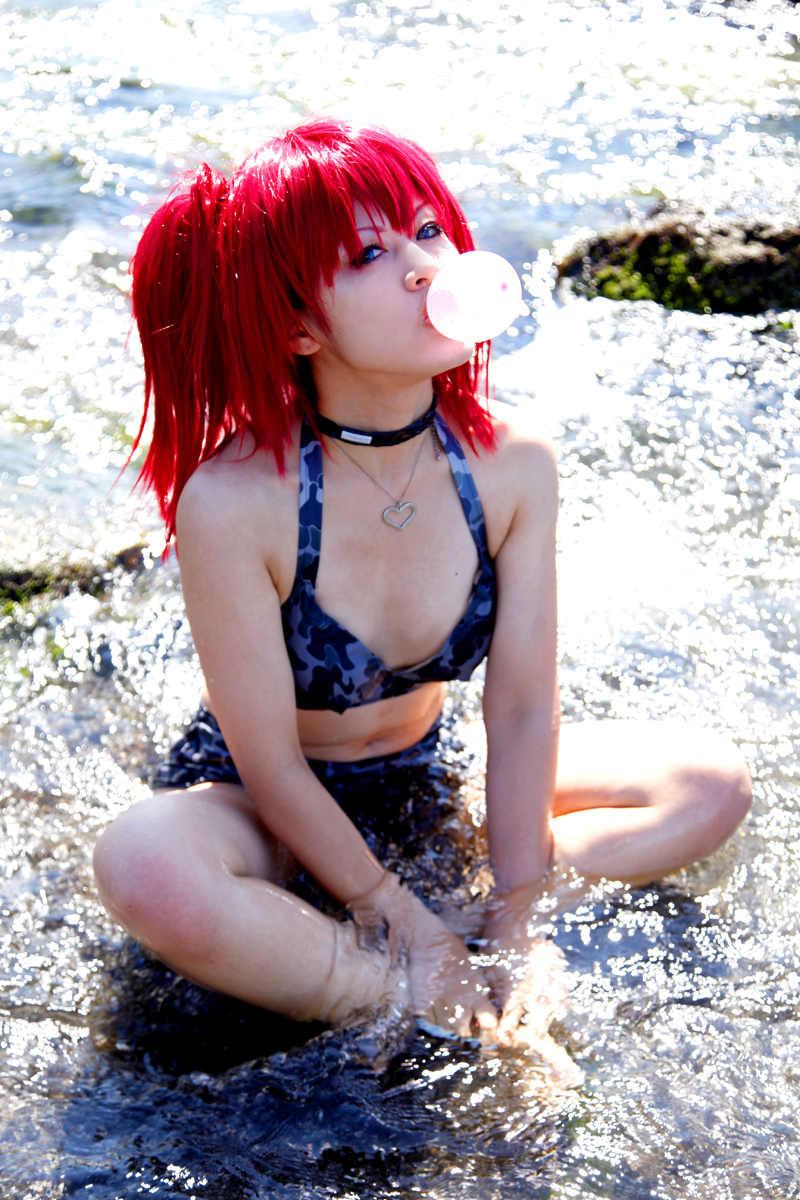 beach bra breasts camouflage_print choker female long_hair midriff necklace outside pigtails red_hair skirt small_breasts solo water