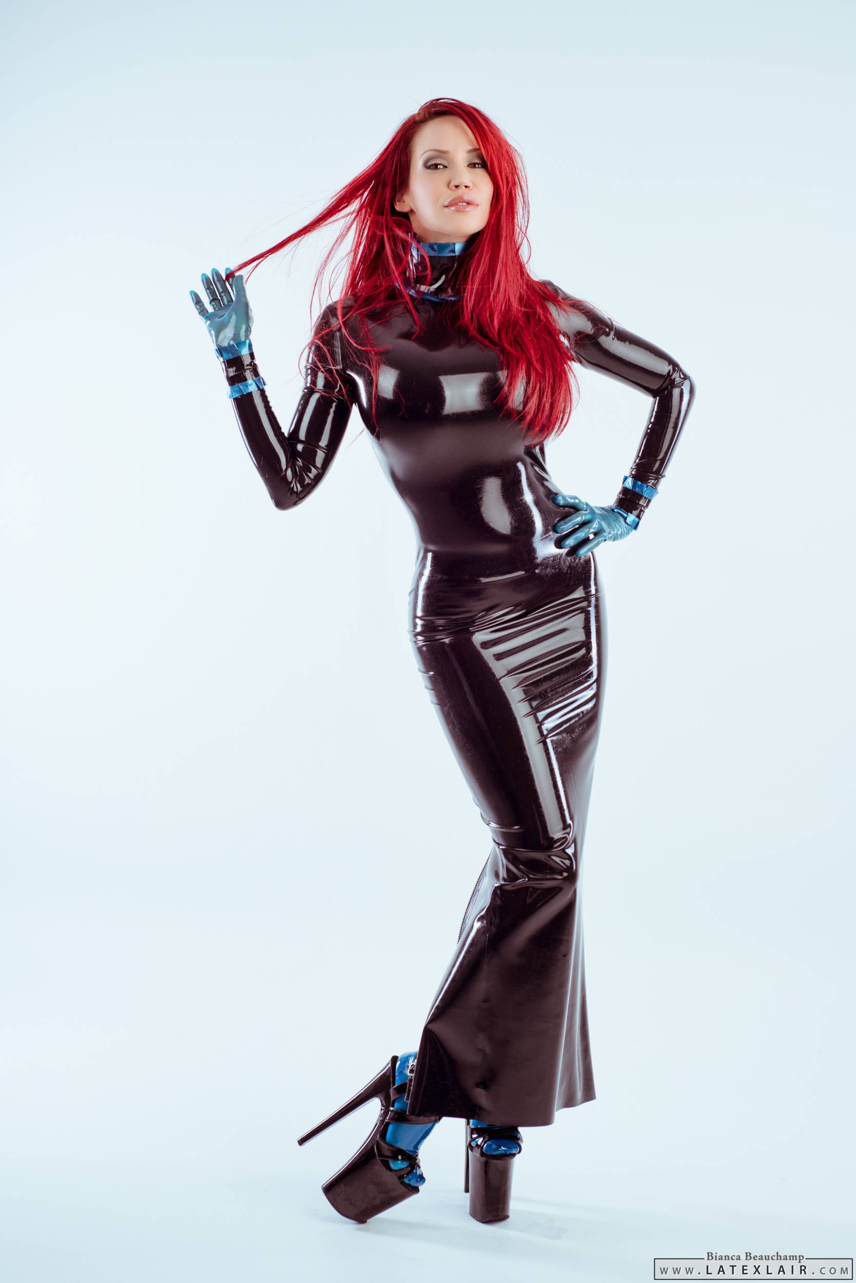 bianca_beauchamp breasts dress female gloves high_heels large_breasts latex long_hair red_hair shoes simple_background solo