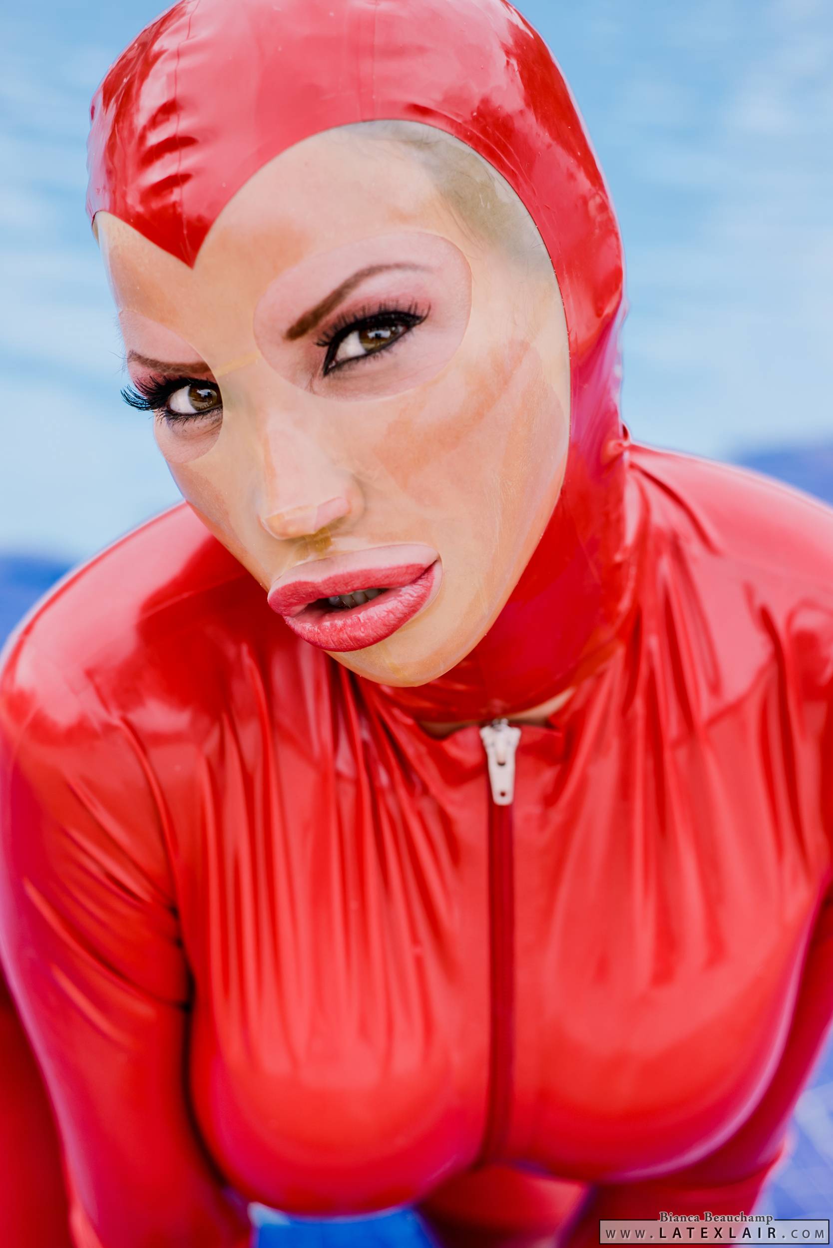 bianca_beauchamp breasts catsuit female gloves large_breasts latex long_hair mask pool red_hair solo water watermark wet