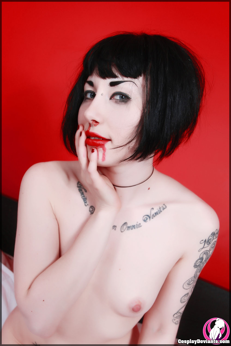 bed black_hair breasts cosplay female long_hair porphyria solo tattoo watermark