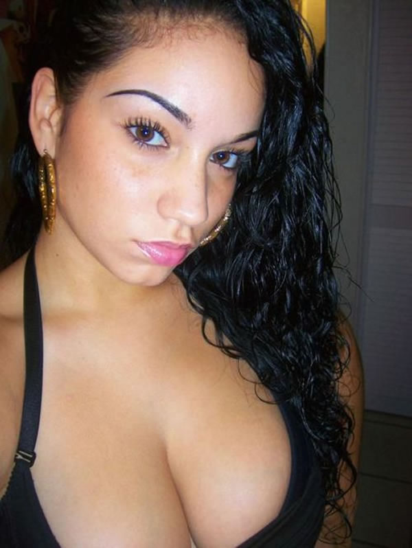 black_hair bra brown_eyes closeup curvy earrings face halterneck large_breasts latina long_hair wavy_hair