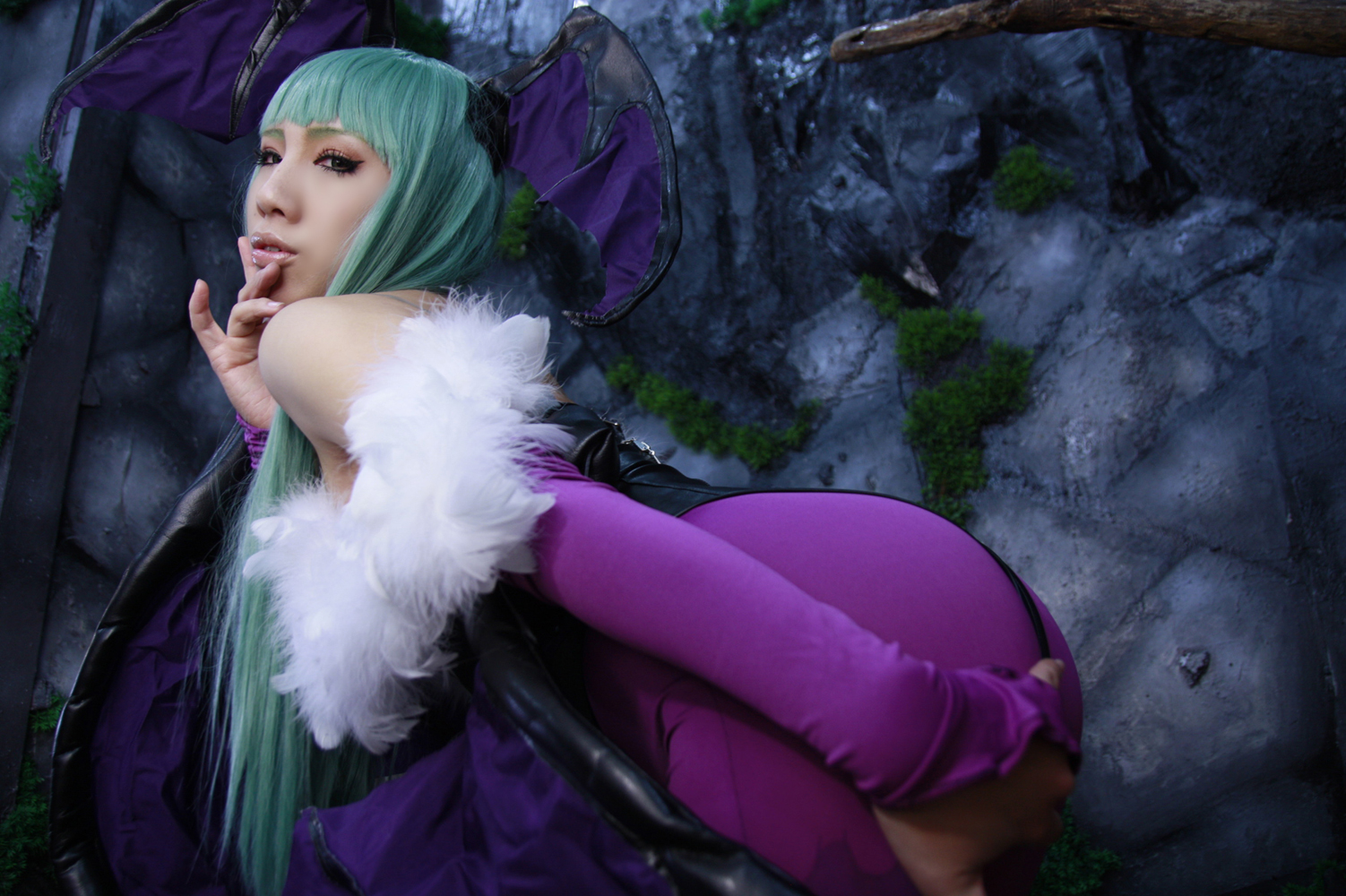 asian ass bare_shoulders breasts cleavage cosplay female green_hair large_breasts leotard long_hair looking_back nonsummerjack solo wings