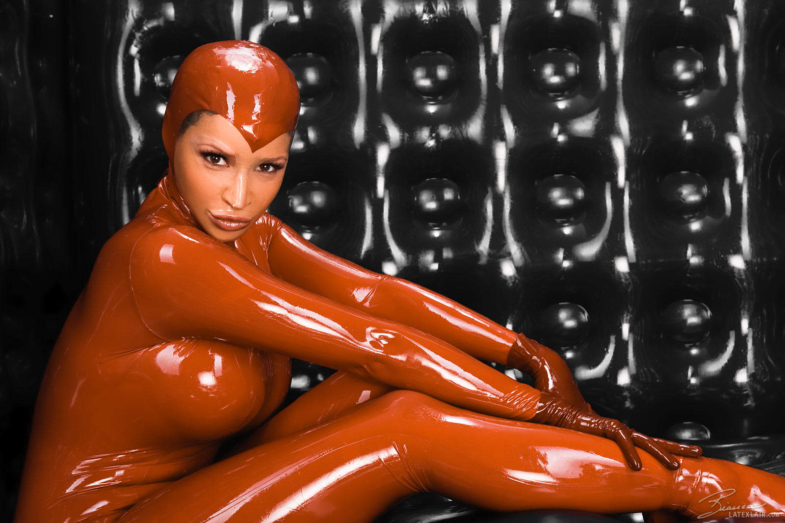 bianca_beauchamp breasts catsuit female gloves large_breasts latex long_hair red_hair solo watermark