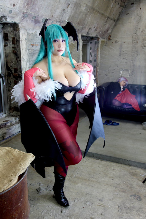 2girls aqua_hair bare_shoulders breasts chouzuki_maryou cleavage cosplay darkstalkers demon_wings female female_only high_heel_boots huge_breasts leotard lilith_aensland long_hair morrigan_aensland non_nude pantyhose partially_clothed plump solo succubus suzuka_itsuki thong_leotard watermark wings