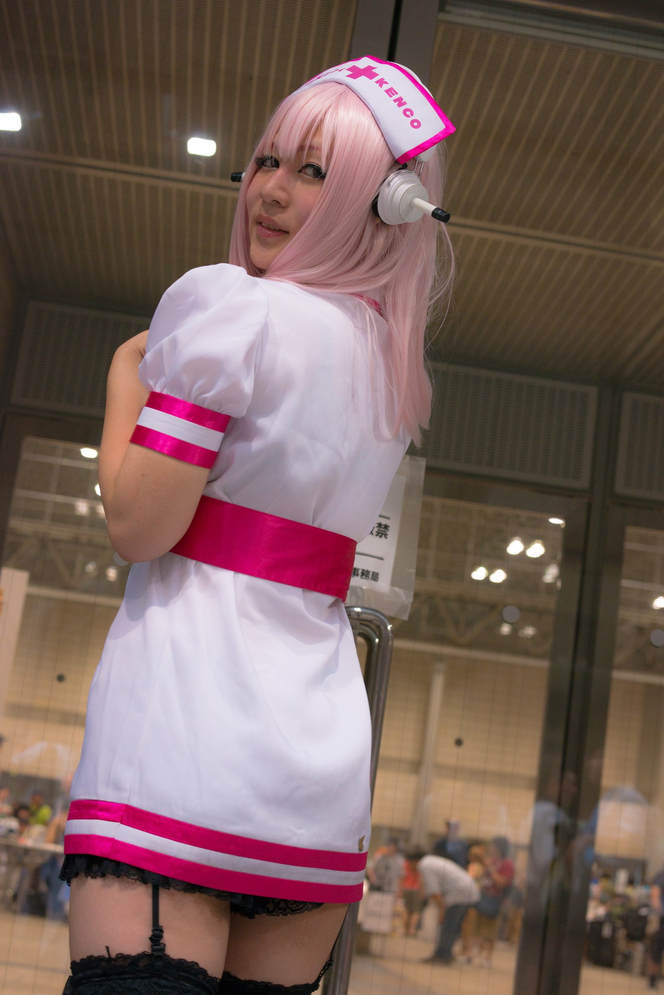 1girl asian breasts cosplay dress female garter_straps headphones japanese long_hair nurse pink_hair solo super_sonico