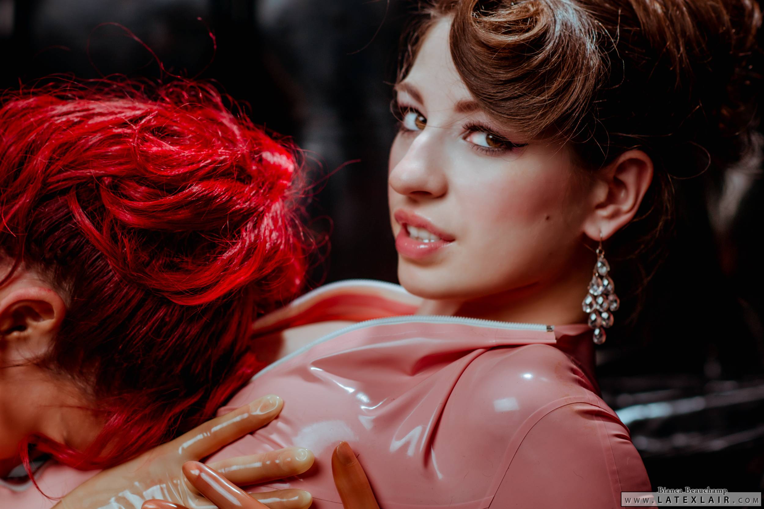 bianca_beauchamp breasts brown_hair catsuit earrings female large_breasts latex long_hair multiple_girls red_hair