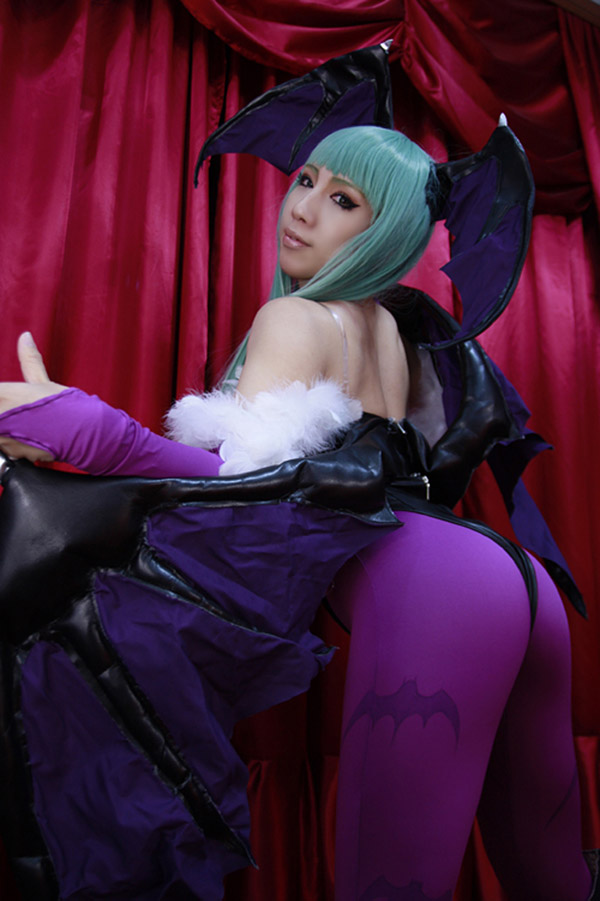 1girl asian ass bat_wings cosplay darkstalkers female female_only head_wings leotard morrigan_aensland photo real real_person solo succubus thong thong_leotard tights