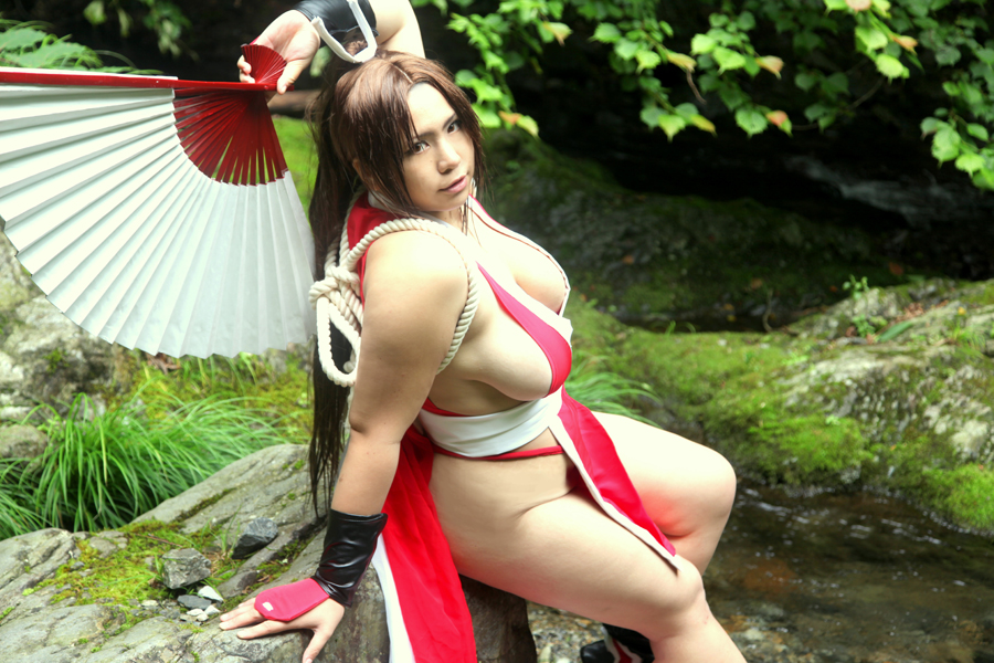 breasts brown_hair chouzuki_maryou cleavage cosplay king_of_fighters large_breasts long_hair mai_shiranui sitting solo water