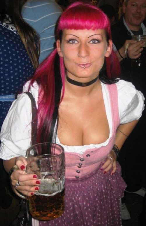 alcohol bavaria beer breasts cleavage dirndl dress female german germany long_hair oktoberfest pink_hair solo_focus thechive.com/2012/09/25/oktoberfest-is-upon-us-once-again-let-the-cleavage-flow-like-beer-45-photos