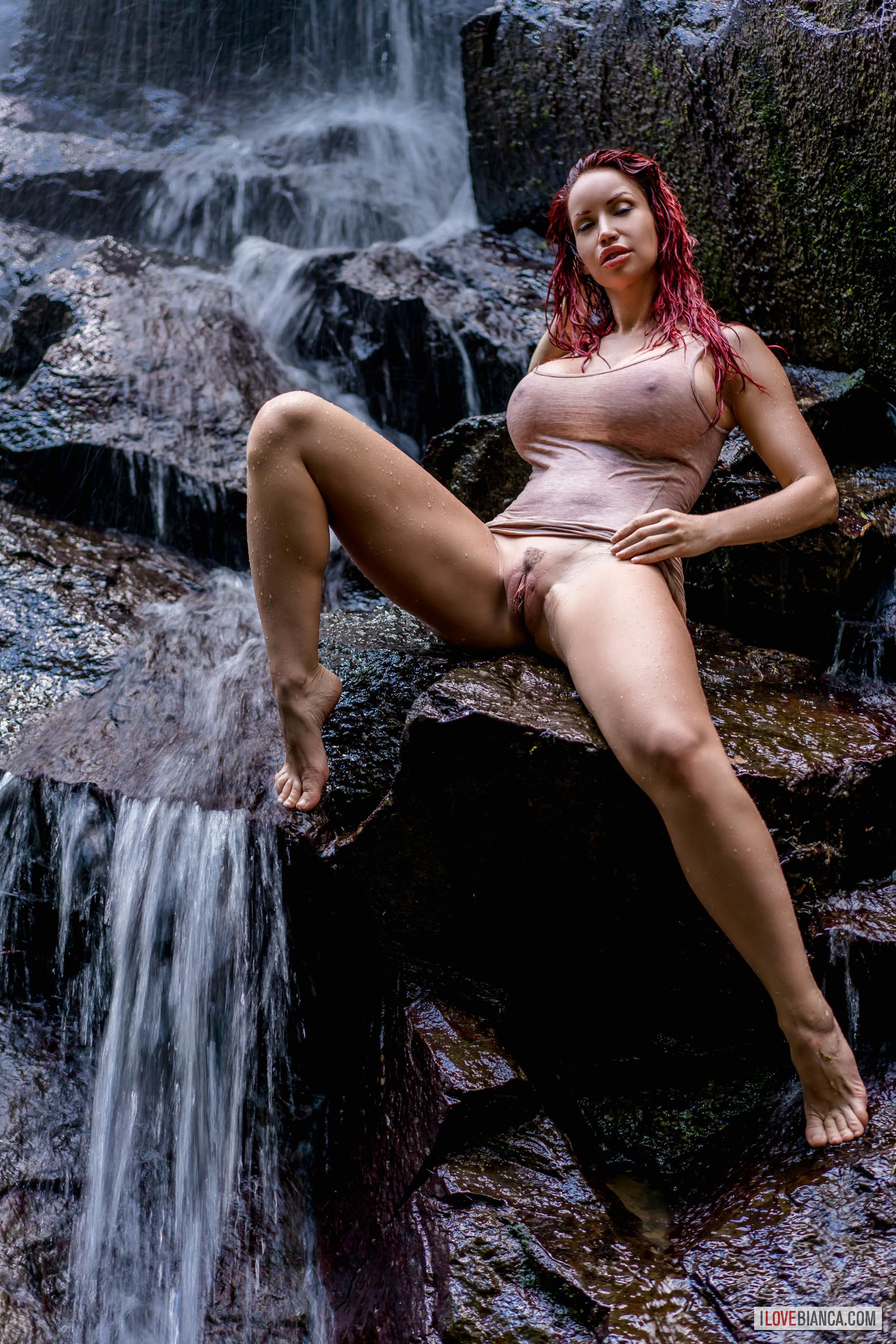 bianca_beauchamp breasts female large_breasts long_hair outside red_hair solo water watermark wet wet_hair