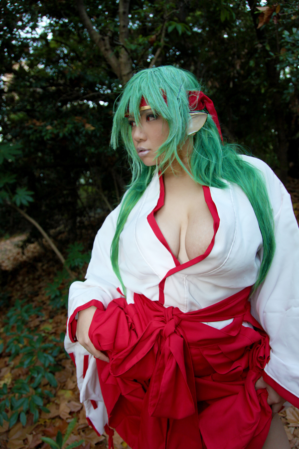 asian breasts chouzuki_maryou cleavage cosplay female green_hair headband huge_breasts long_hair solo