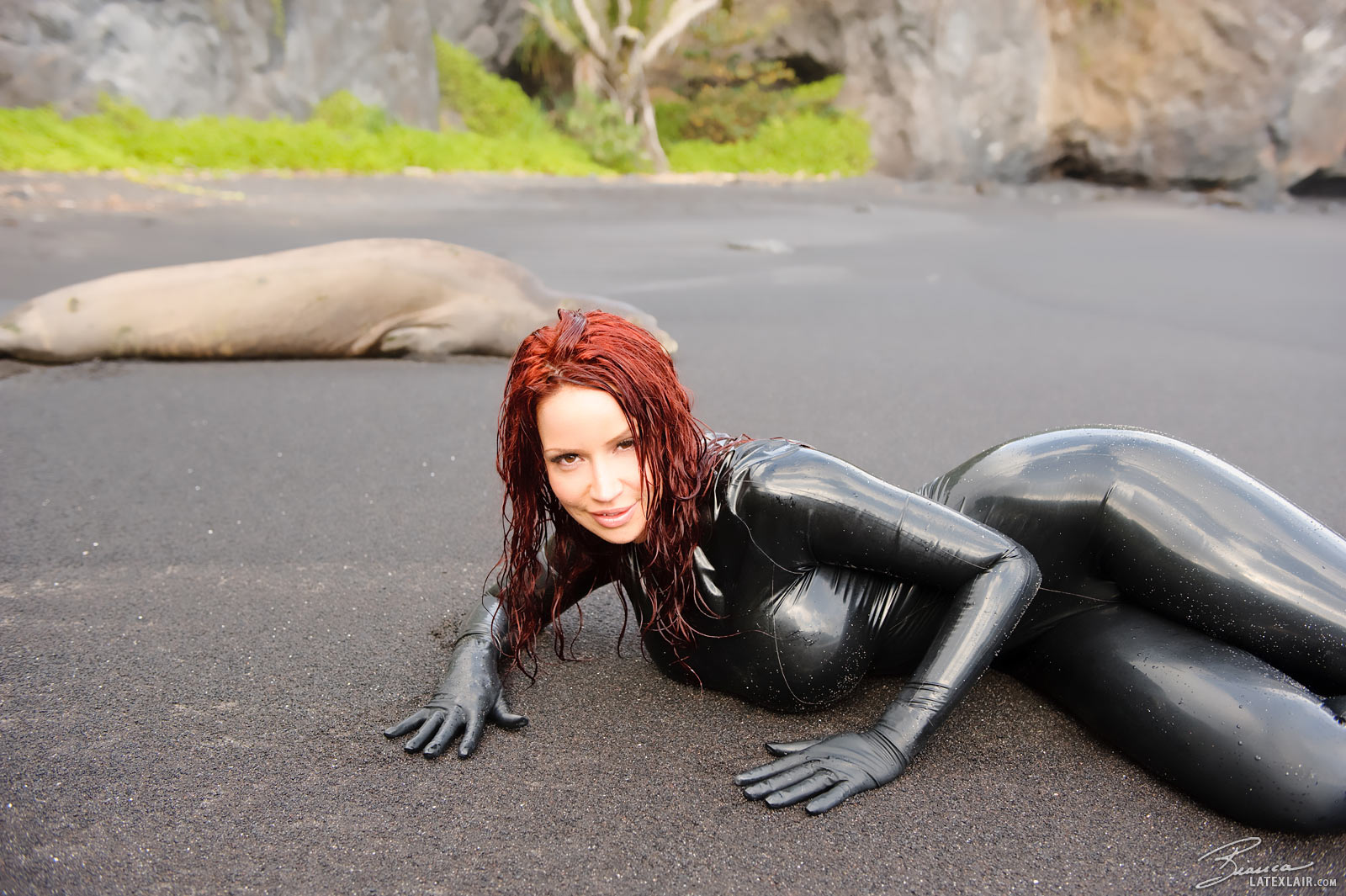beach bianca_beauchamp breasts catsuit female gloves high_heels large_breasts latex long_hair outside red_hair sand shoes solo water watermark wet