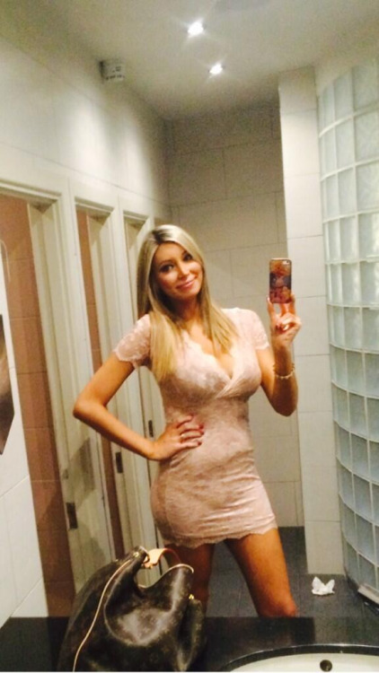 1girl blonde_hair breasts cleavage clothed dress female female_only hand_on_hip mirror nail_polish non-nude phone reflection selfie smile solo tagme white