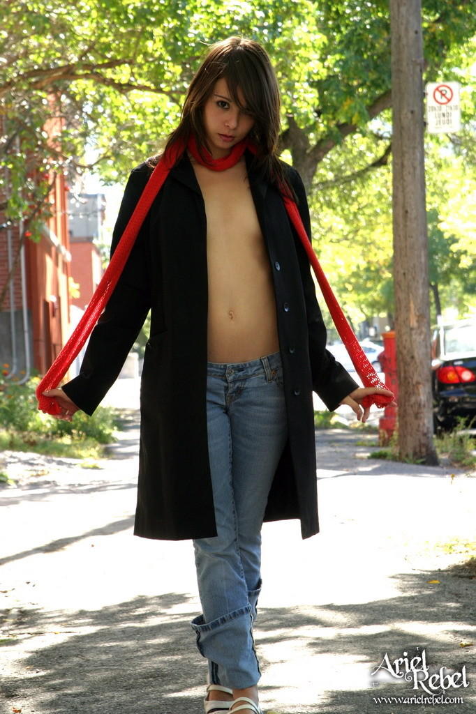 1girl ariel_rebel coat coat_open dark_hair female female_only jeans looking_at_viewer no_bra non-nude outside partially_clothed solo watermark white