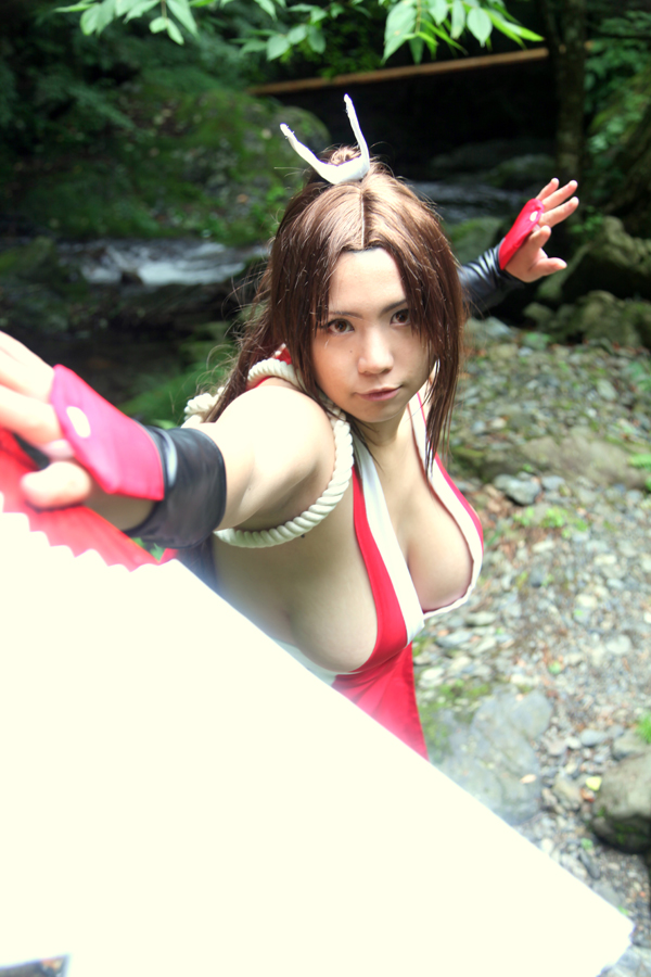 breasts brown_eyes brown_hair chouzuki_maryou cosplay fan female female_only hair_ornament king_of_fighters large_breasts long_hair mai_shiranui mai_shiranui_(cosplay) plump ponytail pose sideboob snk solo thick_thighs thighs tied_hair very_long_hair