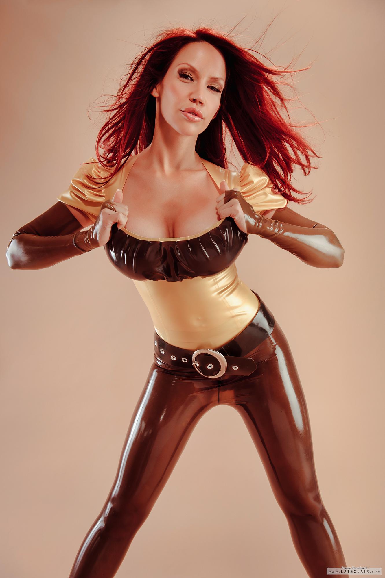 belt bianca_beauchamp breasts female gloves large_breasts latex long_hair midriff red_hair simple_background solo watermark