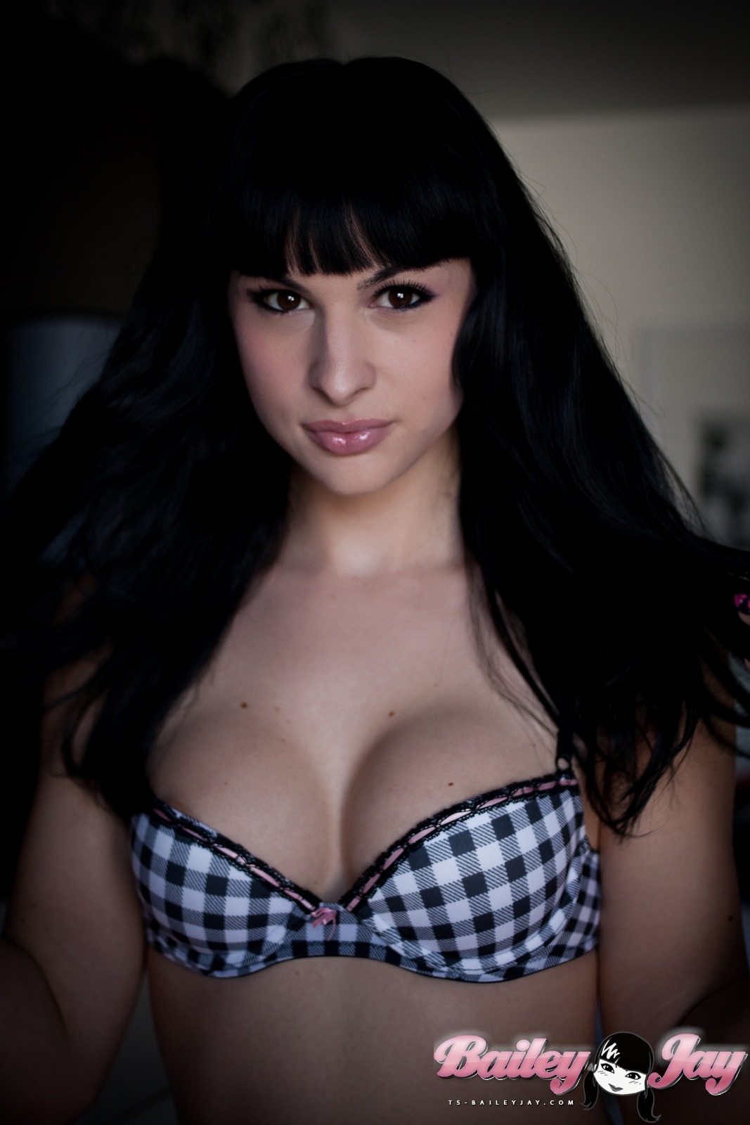 bailey_jay bed black_hair breasts large_breasts long_hair shemale solo tattoo watermark
