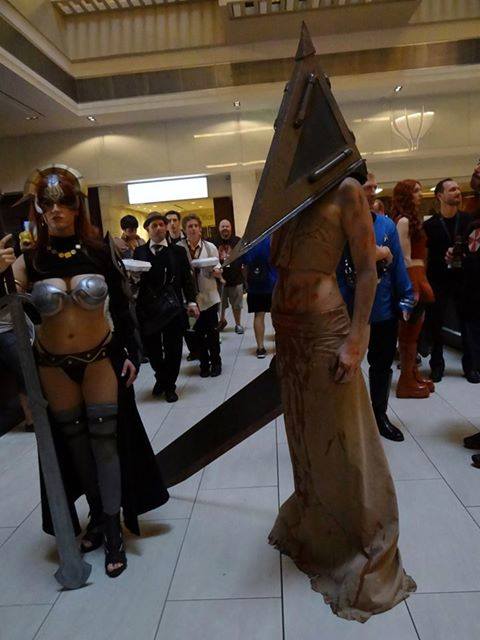breasts cosplay female large_breasts long_hair pyramid_head silent_hill solo sword tagme watermark
