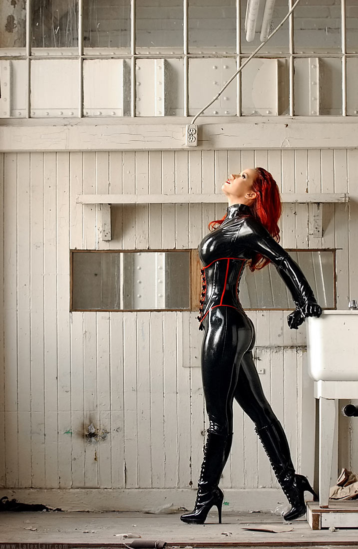 bianca_beauchamp breasts female large_breasts latex long_hair red_hair solo watermark