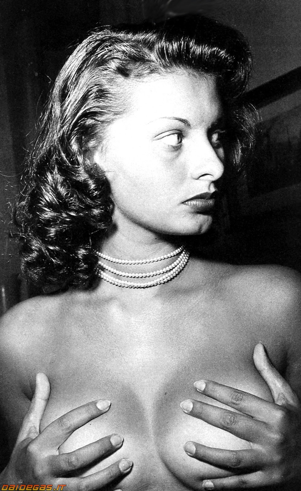 1girl black_and_white breasts female hand_bra jewelry large_breasts lipstick looking_away makeup necklace no_bra sophia_loren
