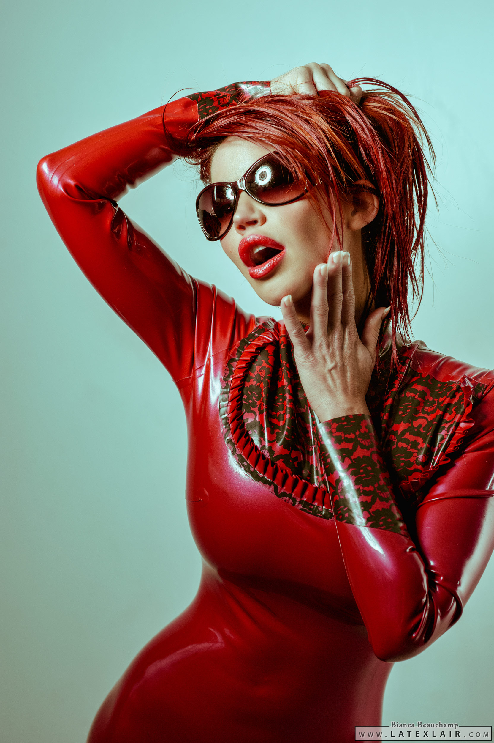 bianca_beauchamp breasts dress female large_breasts latex lipstick long_hair red_hair simple_background solo sunglasses watermark
