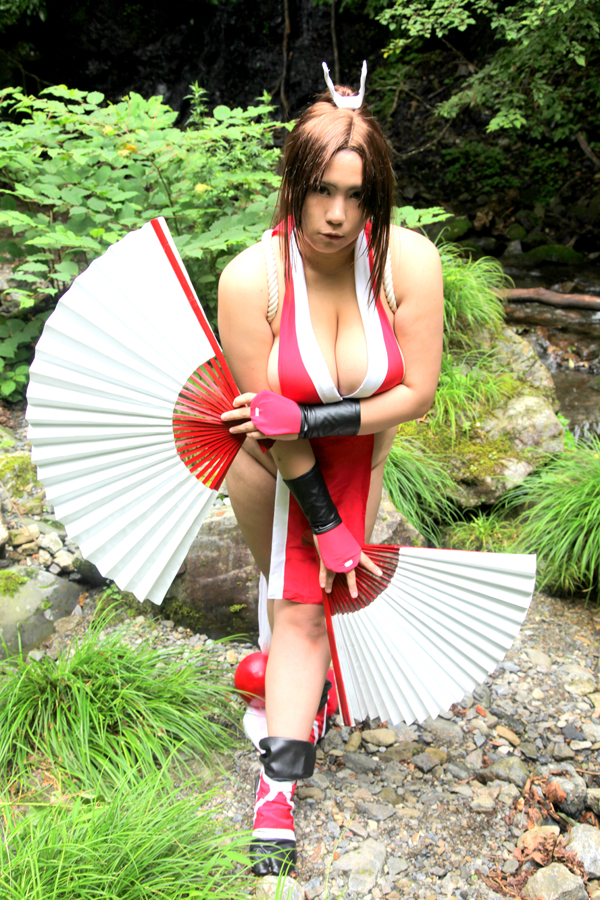 breasts brown_eyes brown_hair chouzuki_maryou cosplay fan female female_only hair_ornament king_of_fighters large_breasts long_hair mai_shiranui mai_shiranui_(cosplay) plump ponytail pose snk solo thick_thighs thighs tied_hair very_long_hair