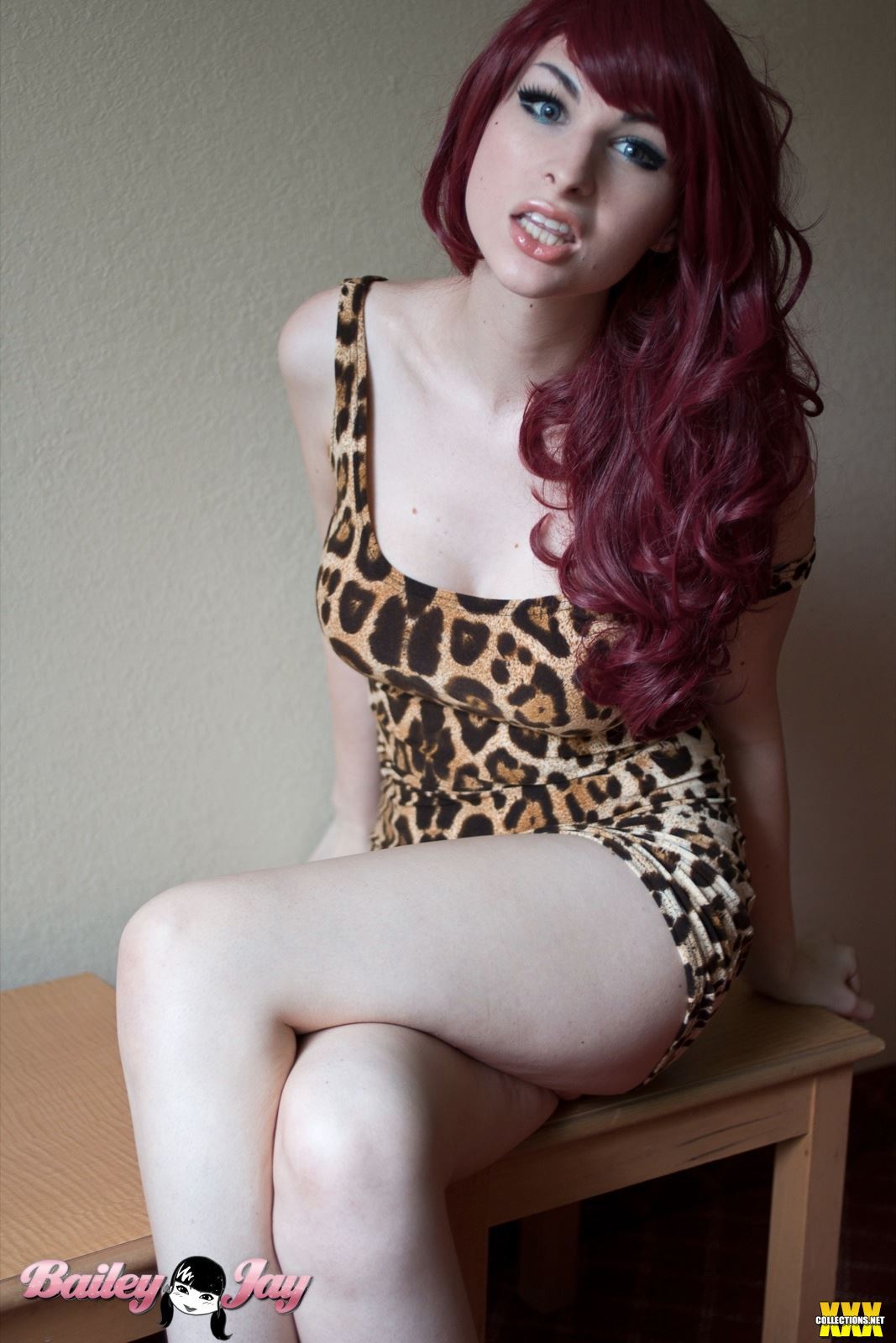 bailey_jay breasts large_breasts long_hair red_hair shemale sitting solo watermark
